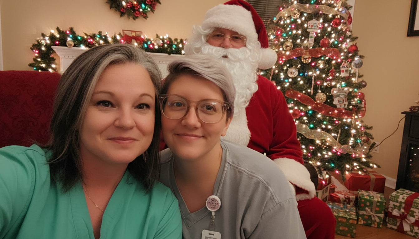 Two nurses posing for a selfie indoors with a decorative wall in the background.