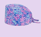 Check out these the Flower-Printed OR Caps! You know, because nothing says 'I'm a professional' like wearing a cap that looks like a garden party exploded on your head