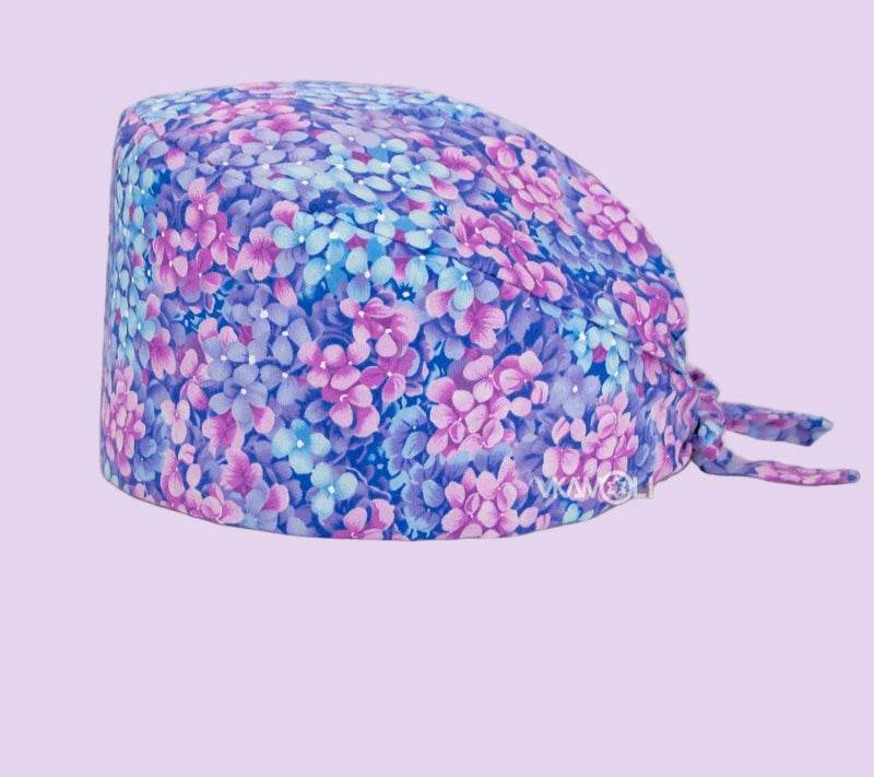Check out these the Flower-Printed OR Caps! You know, because nothing says 'I'm a professional' like wearing a cap that looks like a garden party exploded on your head